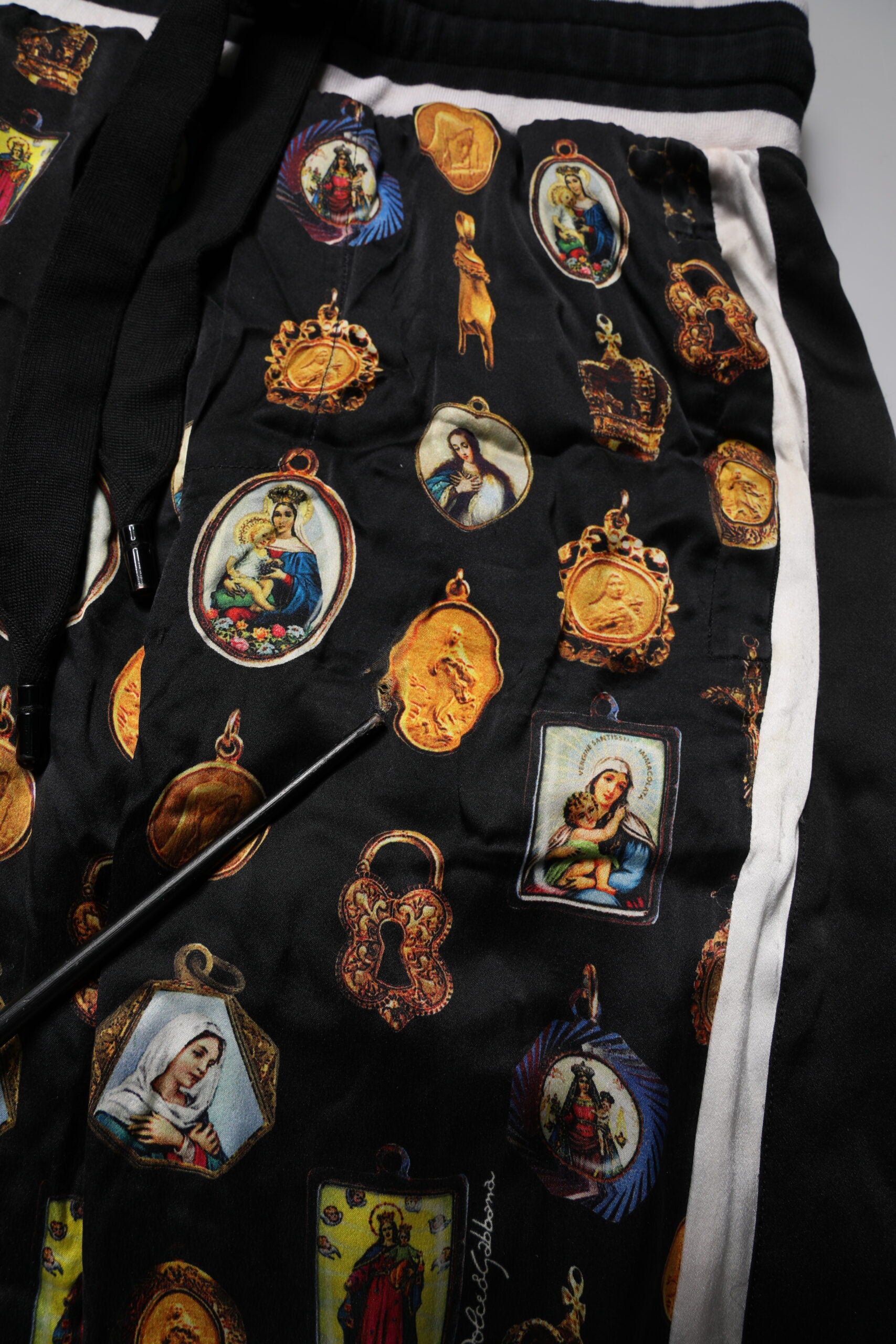 Dolce & Gabbana Black Religious Print Silk Men Jogger Pants | Regal Royce