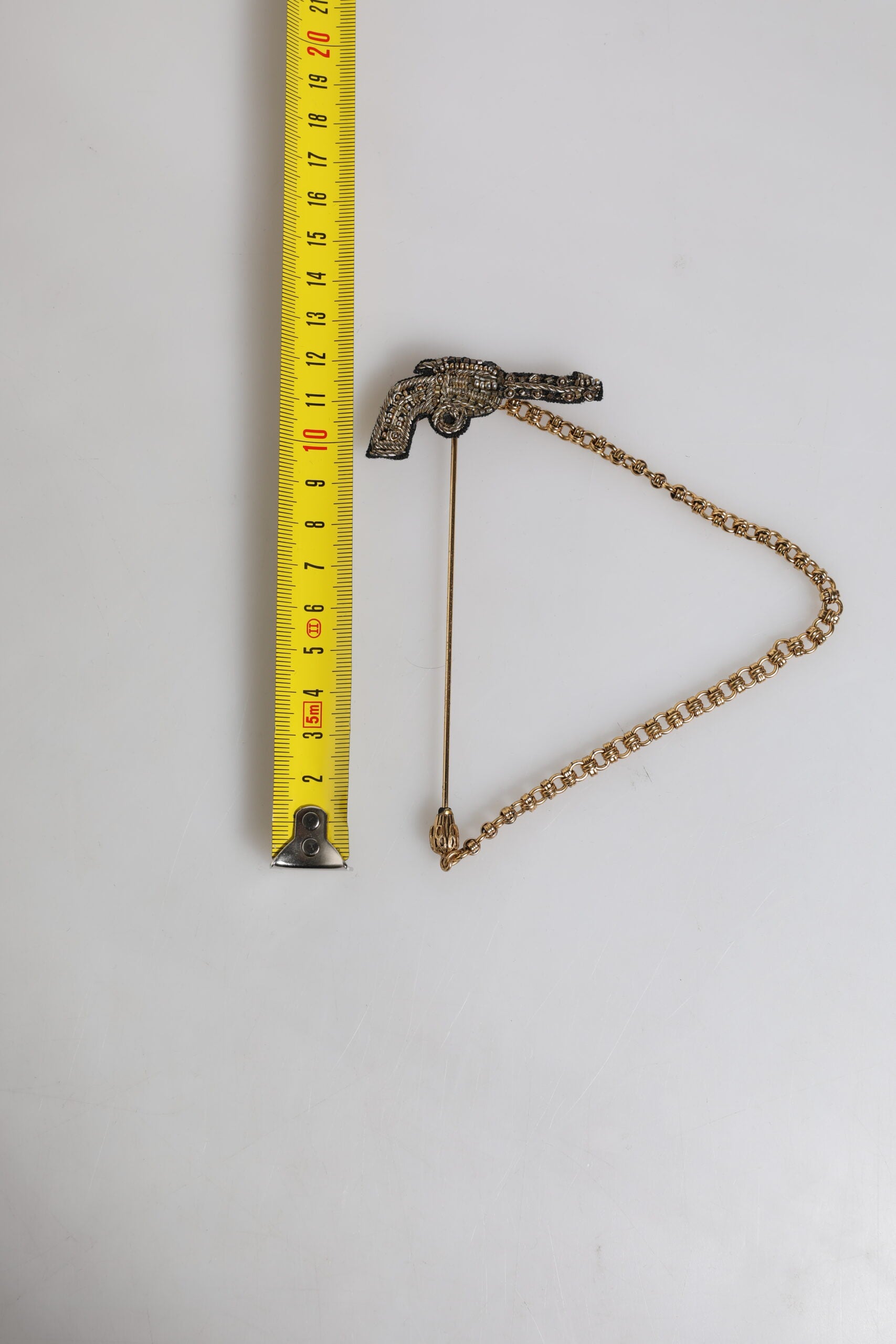 Dolce & Gabbana Black Gold Brass Copper Revolver Brooch Lapel Pin | Regal Royce