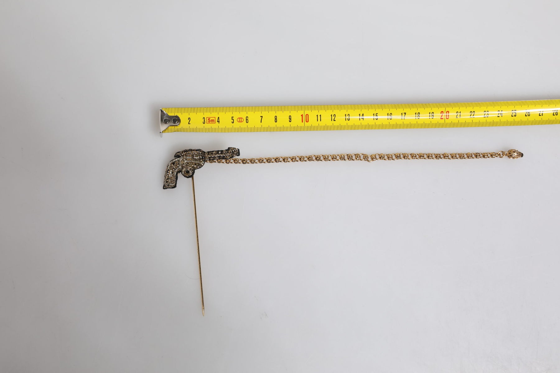 Dolce & Gabbana Black Gold Brass Copper Revolver Brooch Lapel Pin | Regal Royce