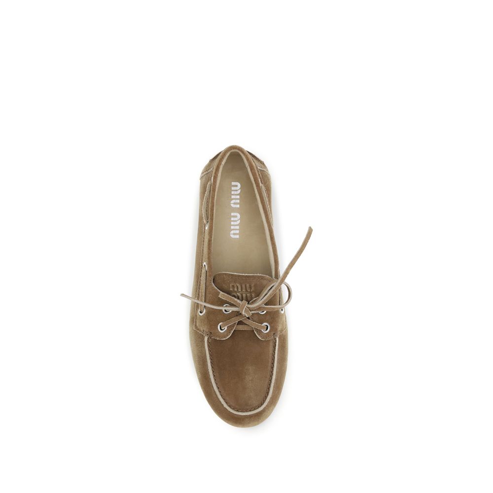 Miu Miu Beige Calf Leather Bos Taurus Slip-On Loafers | Regal Royce